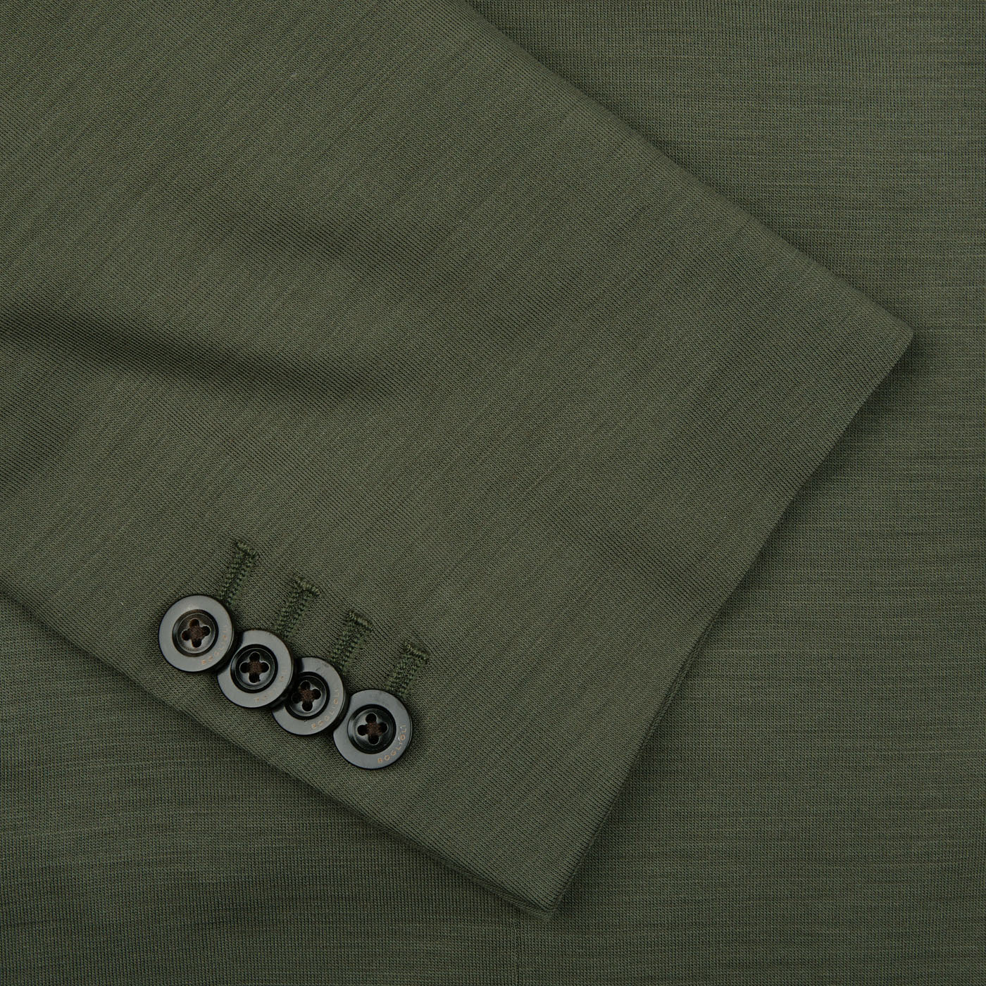 A close up of a Boglioli Dark Green Wool Jersey K Jacket with buttons, showcasing its regular fit and unstructured craftsmanship.