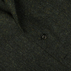 Close-up of the Green Herringbone Wool Tweed K Jacket from Boglioli, featuring a single black button.