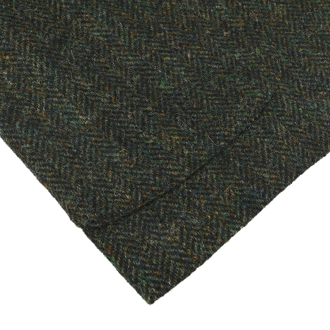 Close-up of a piece of the Green Herringbone Wool Tweed K Jacket by Boglioli. The fabric corner is folded over, showcasing the intricate texture and unstructured craftsmanship.