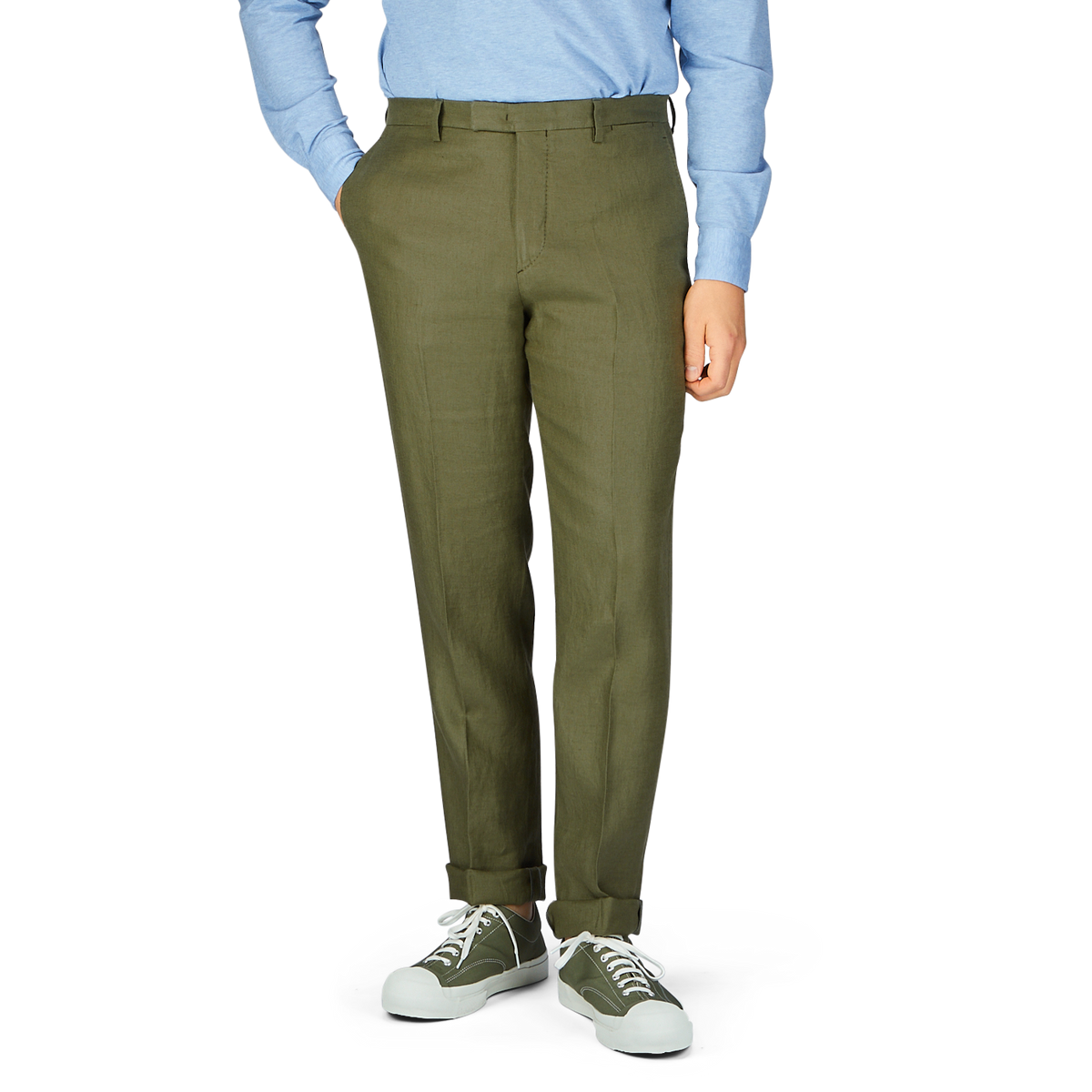 Olive green tapered leg trousers (Green Washed Irish Linen Trousers by Boglioli) paired with casual sneakers and a blue shirt.