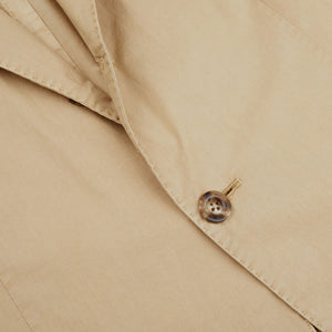 A close up of a Boglioli Khaki Beige Washed Cotton K Jacket with exquisite craftsmanship, featuring a button.