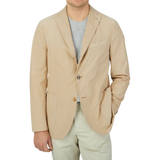 Man wearing a Khaki Beige Washed Cotton Boglioli K Jacket with a light grey t-shirt underneath.