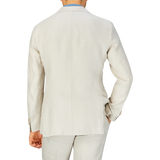 Rear view of a person wearing a light-colored Boglioli Light Beige Washed Irish Linen K Jacket, exemplifying unstructured craftsmanship.