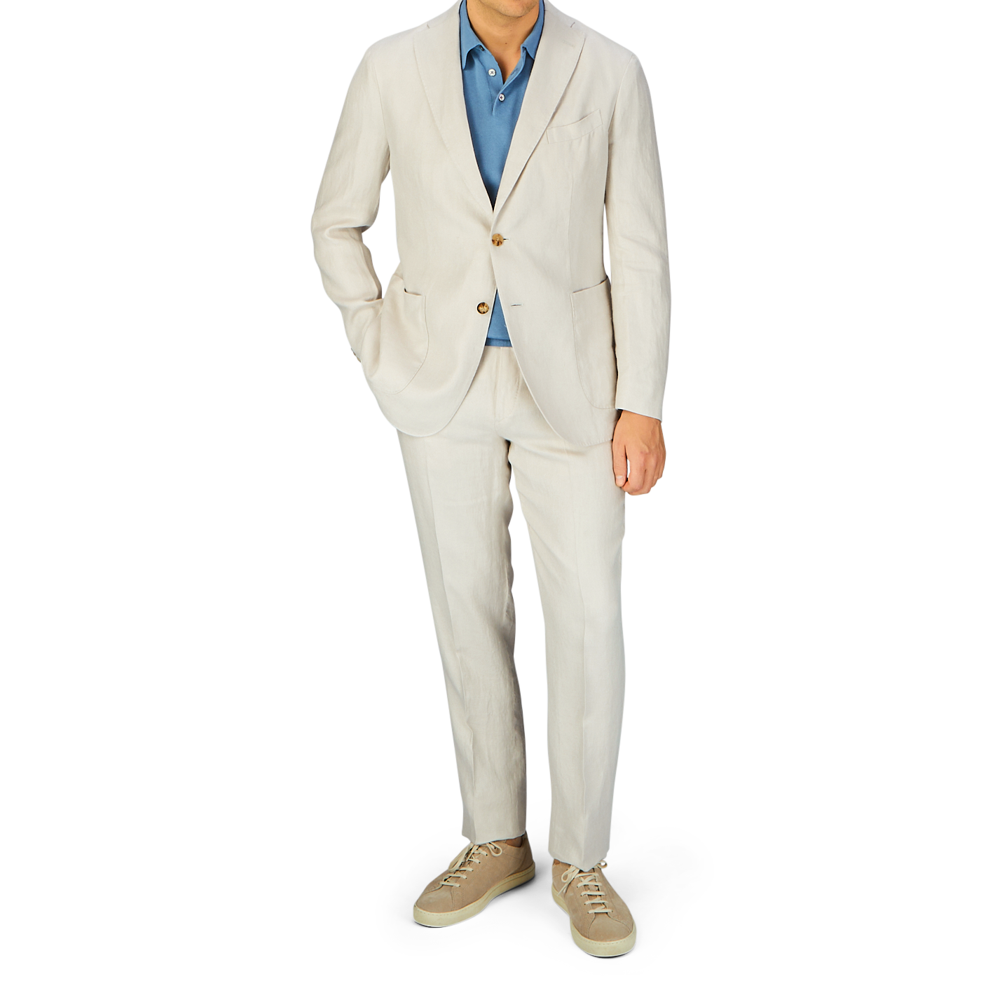 A person wearing a Boglioli Light Beige Washed Irish Linen K Jacket with a blue shirt and matching beige shoes.