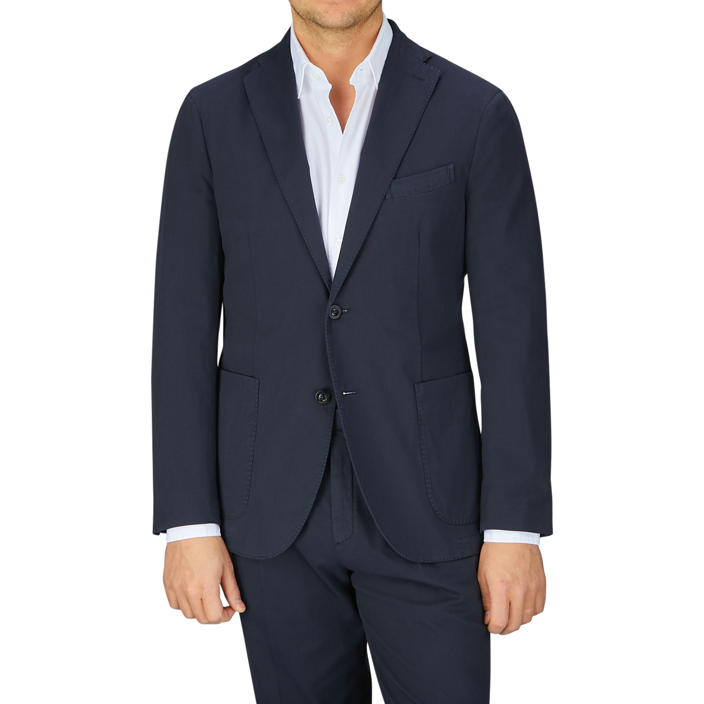 Man wearing an Italian Boglioli Navy Blue Washed Cotton K Jacket with unstructured craftsmanship, fashioned in navy blue and paired with a white shirt.