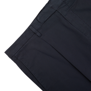 Boglioli Navy Blue Washed Cotton Pleated Trousers on a white background.
