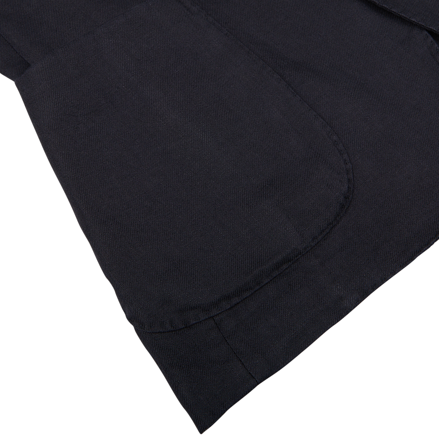 Close-up of a navy blue washed Irish linen Boglioli K.Jacket fabric with detailed stitching on a pocket.