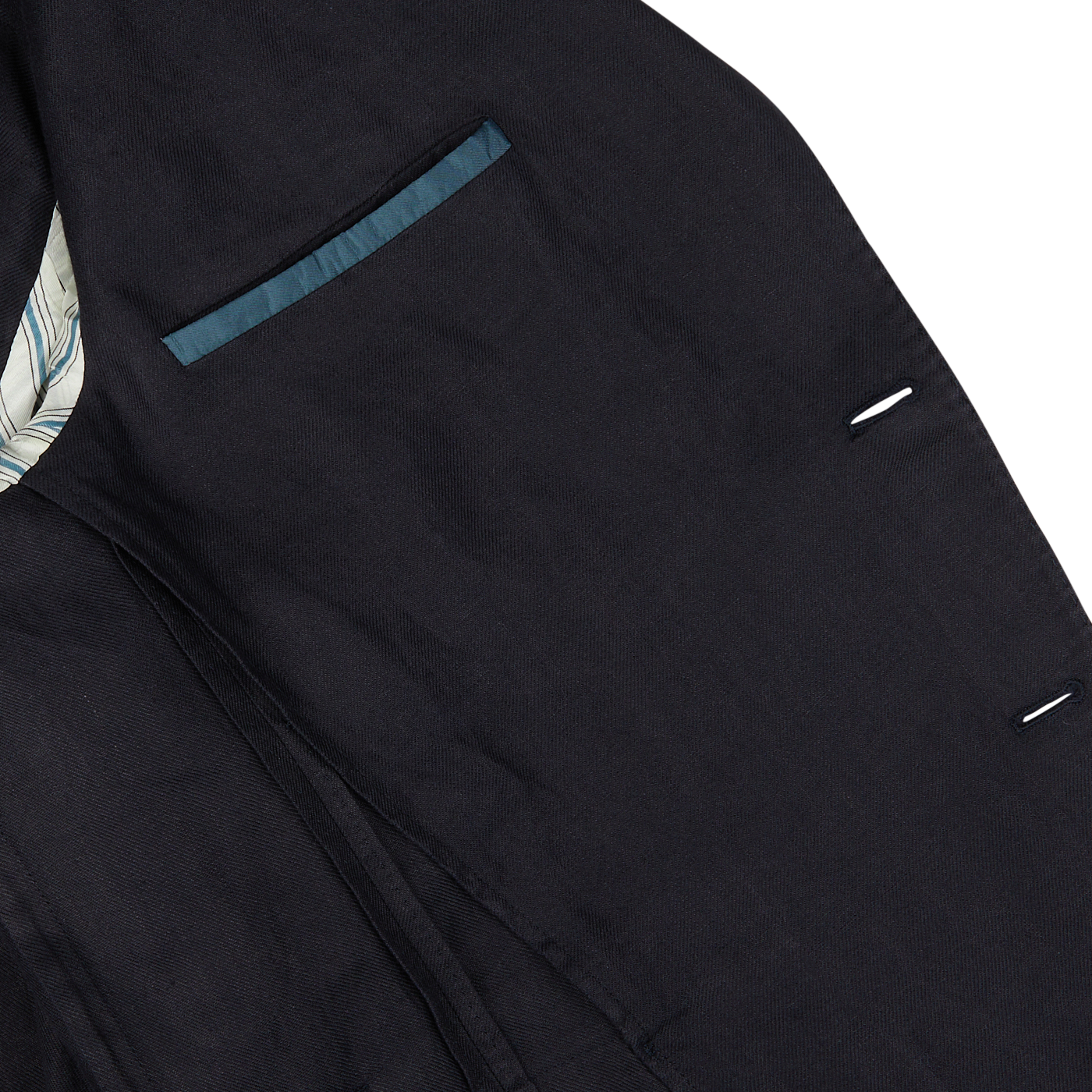Close-up of a Boglioli Navy Blue Washed Irish Linen K Jacket with pocket detailing on a white background.