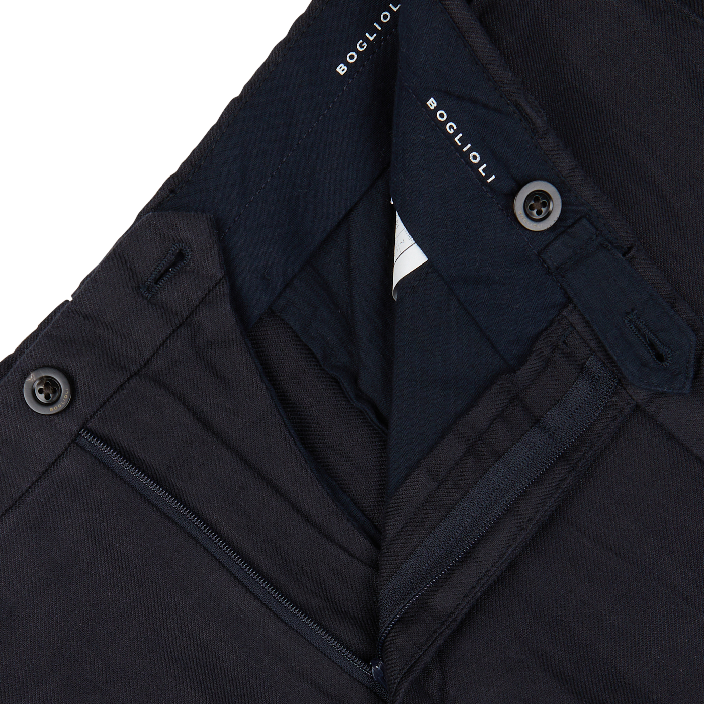 Close-up of Boglioli Navy Blue Washed Irish Linen Trousers with a zipper and buttons visible on pure linen, textured fabric.