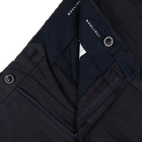 Close-up of Boglioli Navy Blue Washed Irish Linen Trousers with a zipper and buttons visible on pure linen, textured fabric.