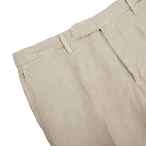 A close up of the Boglioli Sand Beige Washed Linen Unstructured Suit, made with linen fabric.