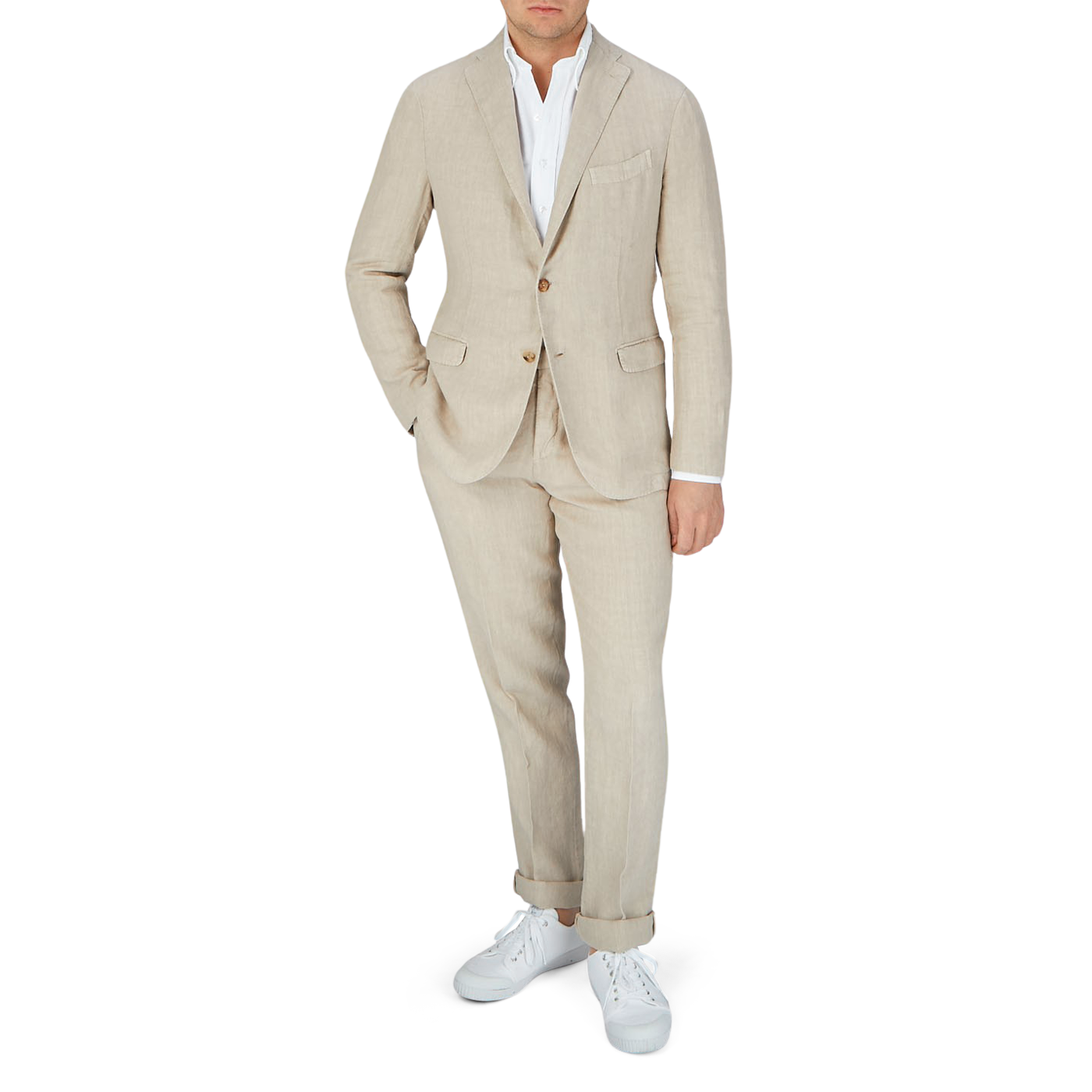 A man in a Boglioli Sand Beige Washed Linen Unstructured Suit, posing for a photo.