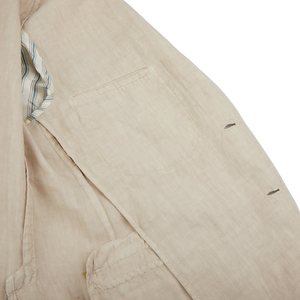 A close up of a Boglioli Sand Beige Washed Linen Unstructured Suit.