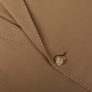 Close-up of a tobacco brown washed cotton Boglioli K jacket with unstructured craftsmanship, featuring button and seam details.