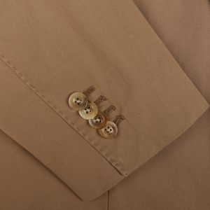 A close-up view of a Tobacco Brown Washed Cotton K Jacket from Boglioli with a row of buttons and detailed stitching, highlighting the brand's unstructured craftsmanship.