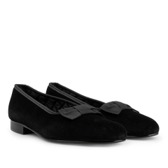 A pair of Bowhill Elliott Black Velvet Bow Opera Pumps with stylish bows on the front, featuring low heels and rounded toes—perfect formal shoes for any occasion.