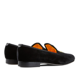 A pair of Black Velvet Bowhill Elliott Slippers with orange lining.
