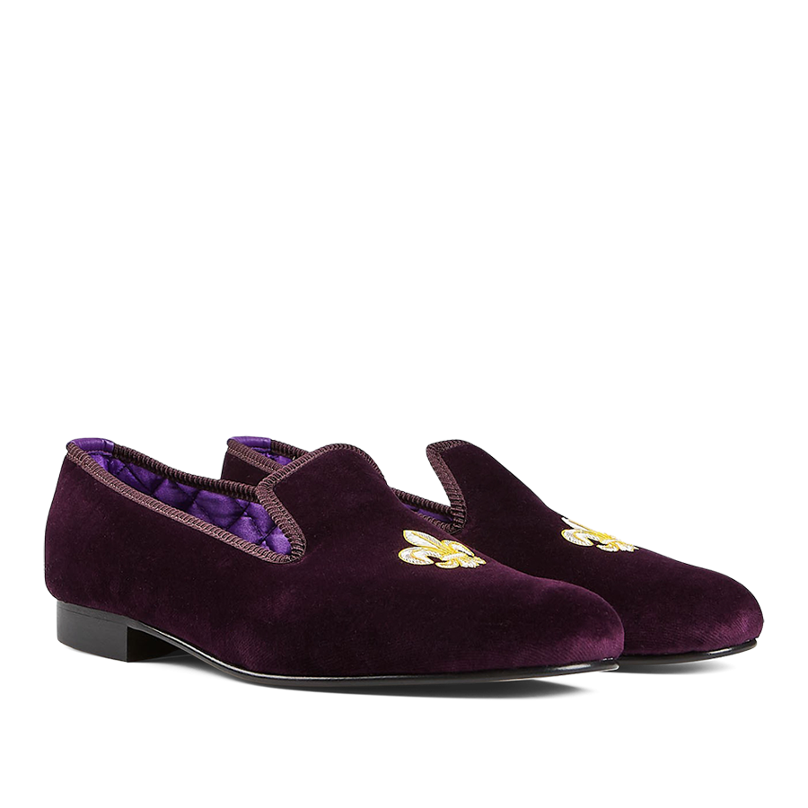 A pair of Regal Purple Velvet Fleur de Lys slippers by Bowhill Elliott with embroidered gold motifs on the upper.