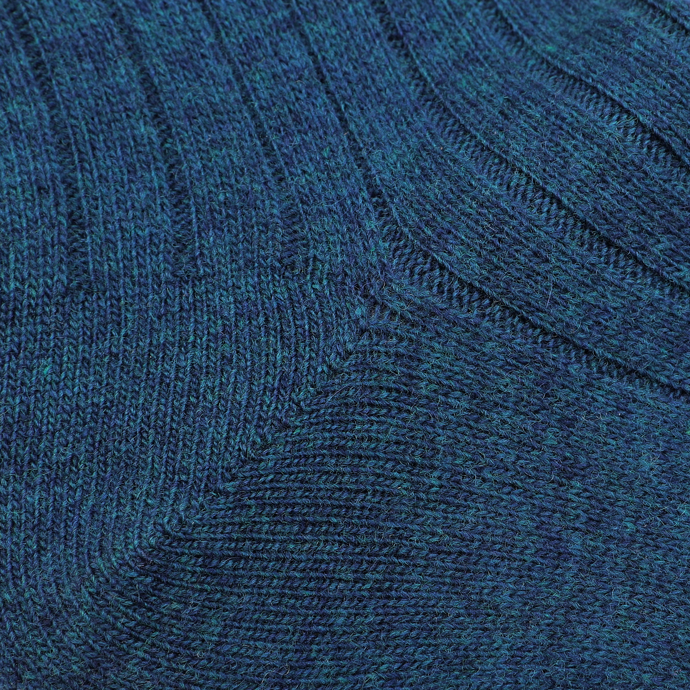 Close-up of the blue melange knitted fabric with a ribbed texture, reminiscent of Bresciani's luxurious Blue Melange Ribbed Wool Cashmere Socks made in Italy.