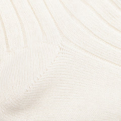 Close-up of the Cream White Ribbed Wool Cashmere Socks by Bresciani, crafted in Italy from a luxurious wool-cashmere blend, showcasing their rich texture and elegant pattern.