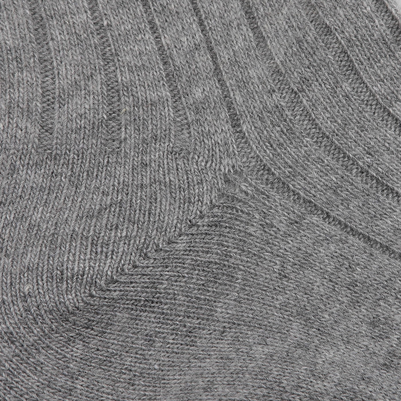 Close-up of a luxurious gray knitted wool-cashmere blend fabric with a ribbed pattern, reminiscent of the premium Grey Melange Ribbed Wool Cashmere Socks expertly crafted in Italy by Bresciani.