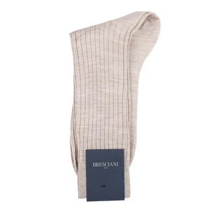 A pair of light beige ribbed socks crafted from a luxurious wool-nylon blend, featuring the Bresciani navy label and made in Italy.