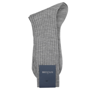 The Light Grey Ribbed Wool Nylon Socks by Bresciani, neatly folded with a blue brand label, are crafted in Italy from a premium wool-nylon blend, effortlessly combining comfort and style.