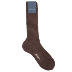 Crafted in Italy, the Rust Brown Ribbed Wool Nylon Socks by Bresciani offer a stylish and comfortable blend. Made from a wool-nylon mix, these socks feature an attached tag and subtly display the brand name near the toe.