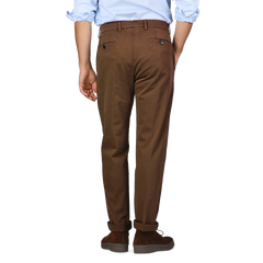 A person wearing Briglia's Brown Cotton Stretch Soho Trousers, a blue shirt, and brown shoes is shown from the back, standing against a plain background.