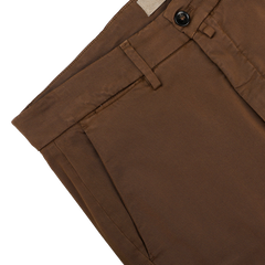 Close-up of Briglia's Brown Cotton Stretch Soho Trousers, designed with soft cotton twill, belt loops, and a top button, displayed flat on a white surface.