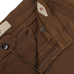 The Brown Cotton Stretch Soho Trousers by Briglia feature a visible button and partially open zipper fly, revealing an inside size tag labeled "48." Made from cotton twill, these trousers offer a regular fit that combines style with comfort.