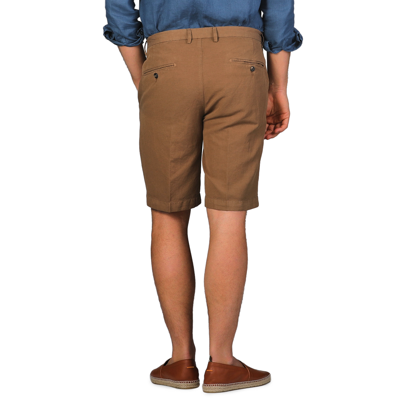 Rear view of a person wearing a blue shirt and Briglia's Camel Brown Cotton Linen Drawstring Malibu Shorts paired with matching shoes.