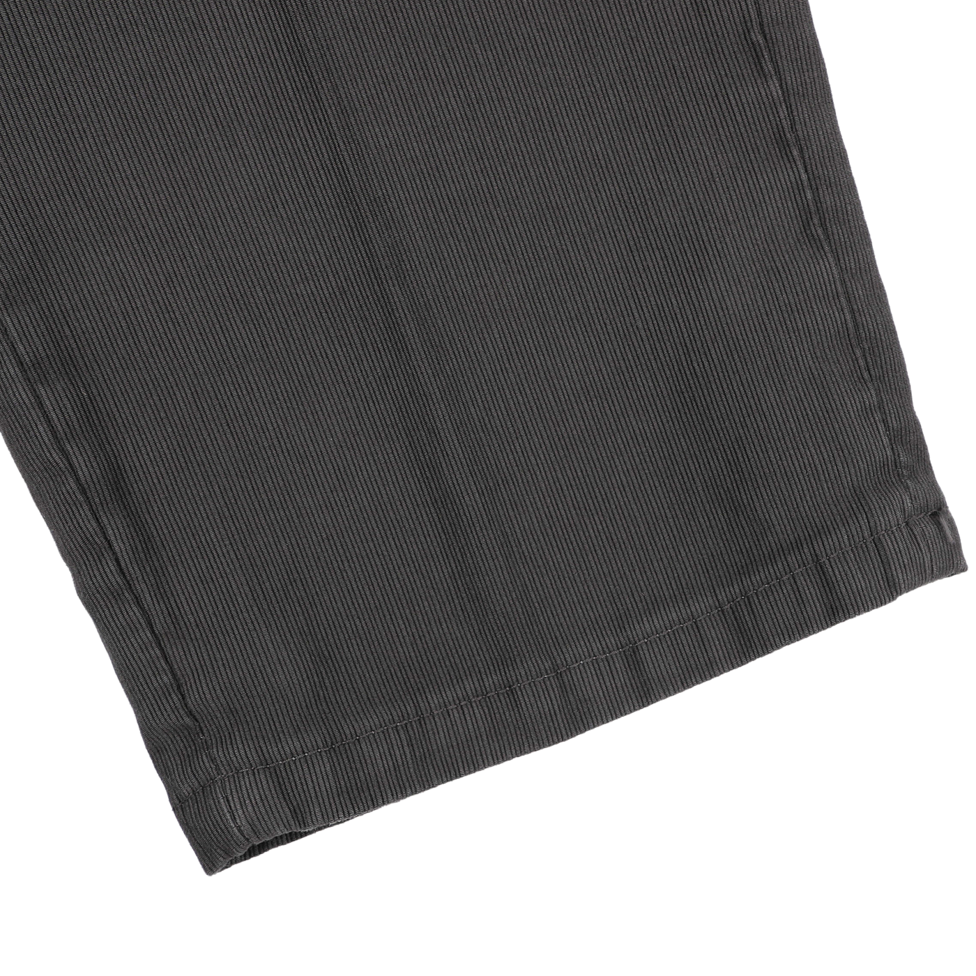 Close-up of the hem of dark grey cotton twill BG21 pleated trousers crafted by Briglia, highlighting their sophisticated texture against a white background.