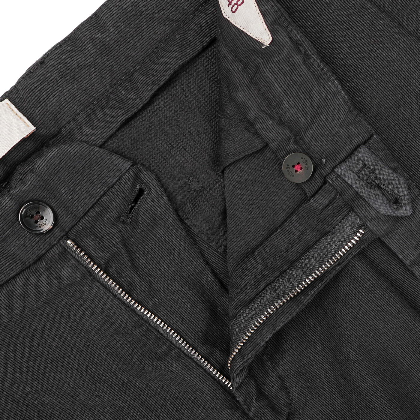 Close-up of Briglia's Dark Grey Cotton Twill BG21 Pleated Trousers, featuring a partially open zipper and black buttons at the waistband.