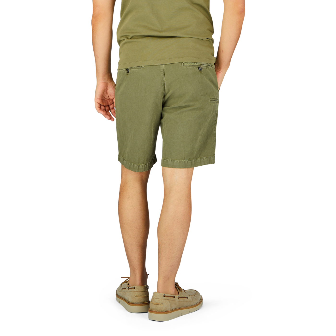 Person standing in Briglia grass green cotton linen pleated shorts and beige sandals against a white background.