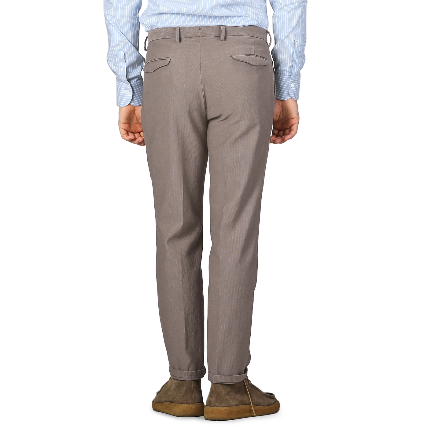 Rear view of a person wearing a blue pinstriped shirt, Briglia's Mole Brown Cotton Twill BG21 Pleated Trousers, and brown shoes standing against a plain background.