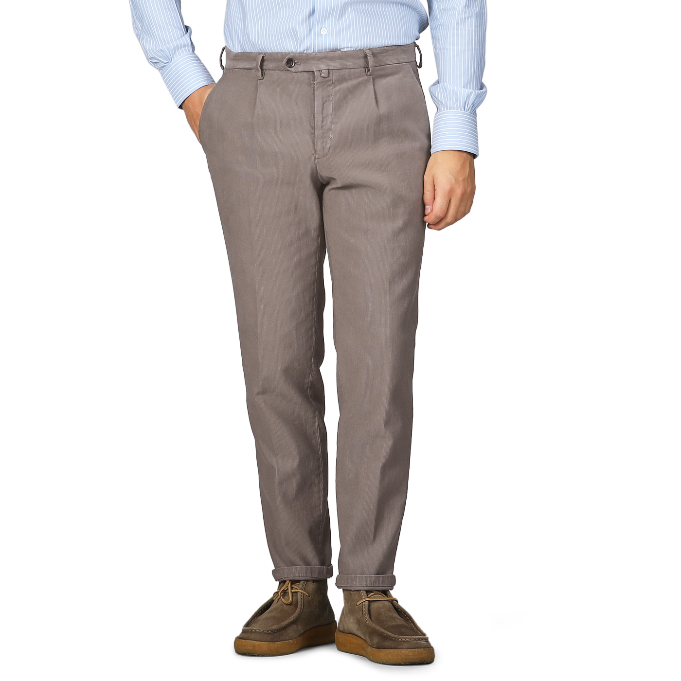 Person wearing Mole Brown Cotton BG21 Pleated Trousers by Briglia and brown shoes, with hands in pockets, against a gray background.