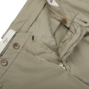 A close up of a pair of beige Mole Cotton Stretch BG07 Pleated Chinos by Italian trouser specialist Briglia.