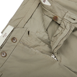 A close up of a pair of beige Mole Cotton Stretch BG07 Pleated Chinos by Italian trouser specialist Briglia.