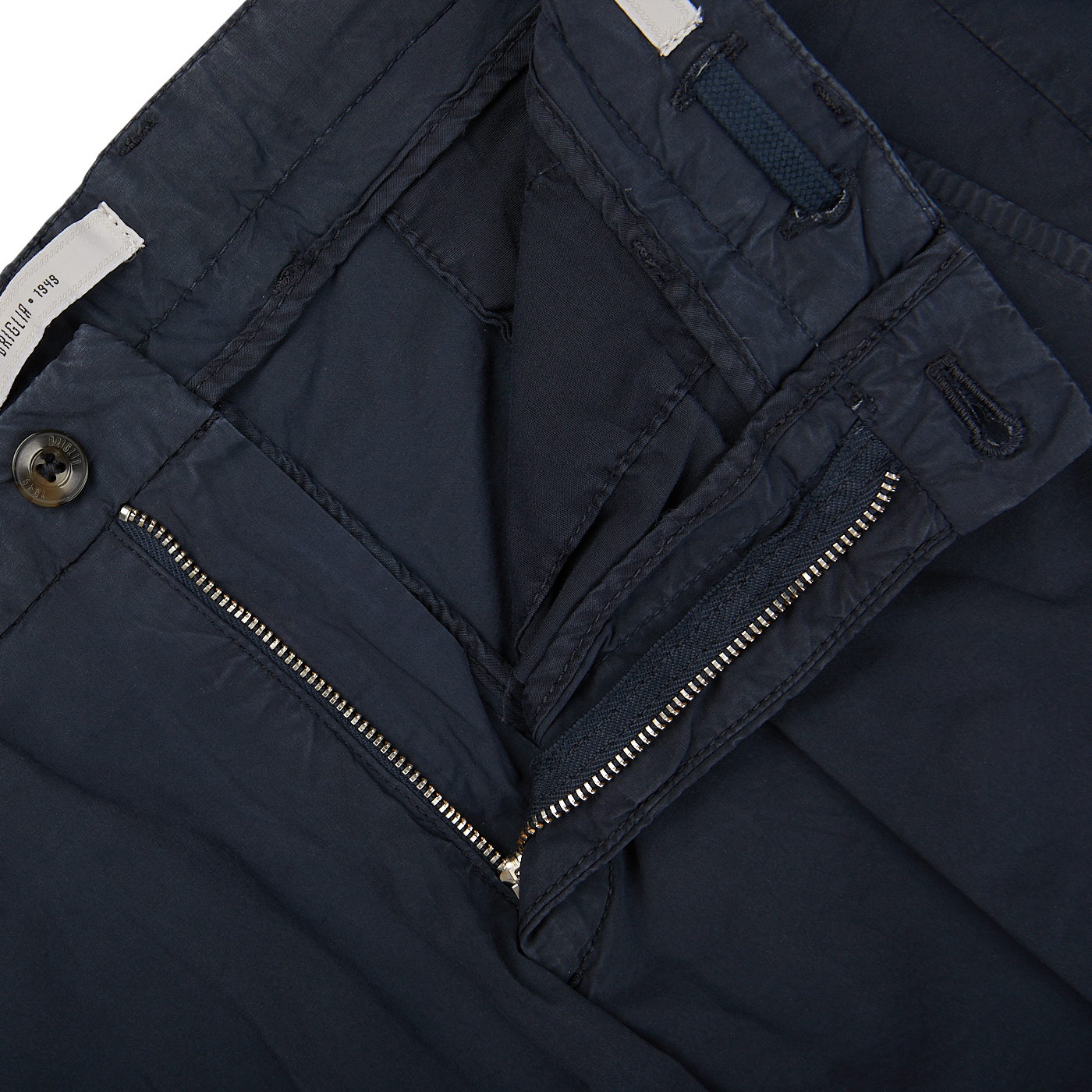 Close-up of Briglia navy blue cotton drawstring Malibu shorts with a zipper detail, button closure, and an adjustable waistband.