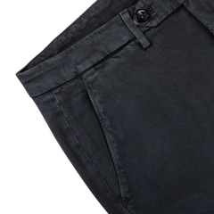 Close-up of a pair of Briglia's Navy Blue Cotton Stretch BG62 Trousers showing a pocket, waistband with belt loops, and a partially visible buttoned tab closure.