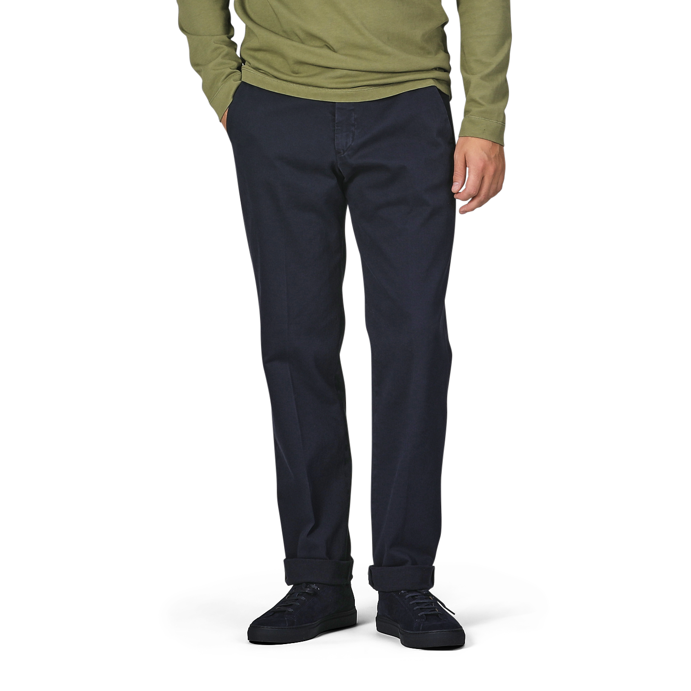 A person in a green long-sleeve top, Briglia's Navy Blue Cotton Stretch Soho Trousers, and black shoes stands against a plain background with hands in pockets.