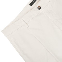 Close-up of Briglia's Off White Corduroy Courmayeur Trousers, showcasing the waistband, button, zipper fly, and belt loop details.