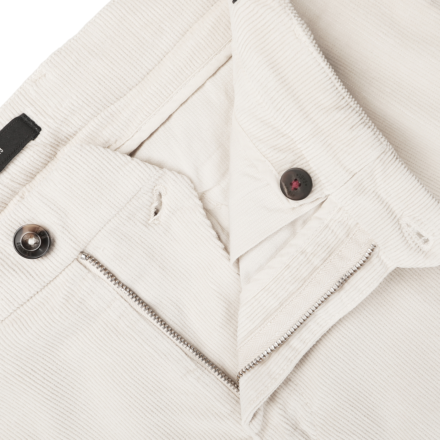 Close-up of a pair of Off White Corduroy Courmayeur Trousers by Briglia, showcasing the button, zipper, and waistband details.