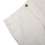Stone Beige Cotton Linen Pleated Shorts by Briglia with a focus on the button closure.