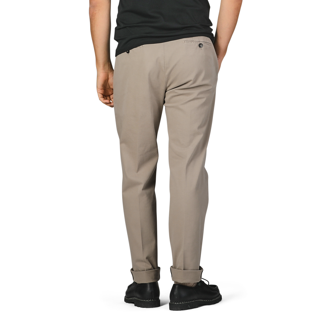 A man is seen from the back wearing black shoes, a black shirt, and Briglia's Taupe Beige Cotton Stretch Soho Trousers. These regular fit cotton twill trousers feature a single back pocket with a button.