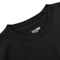 This black crewneck t-shirt by C.O.F Studio, crafted from organic cotton, features the label printed inside the collar.