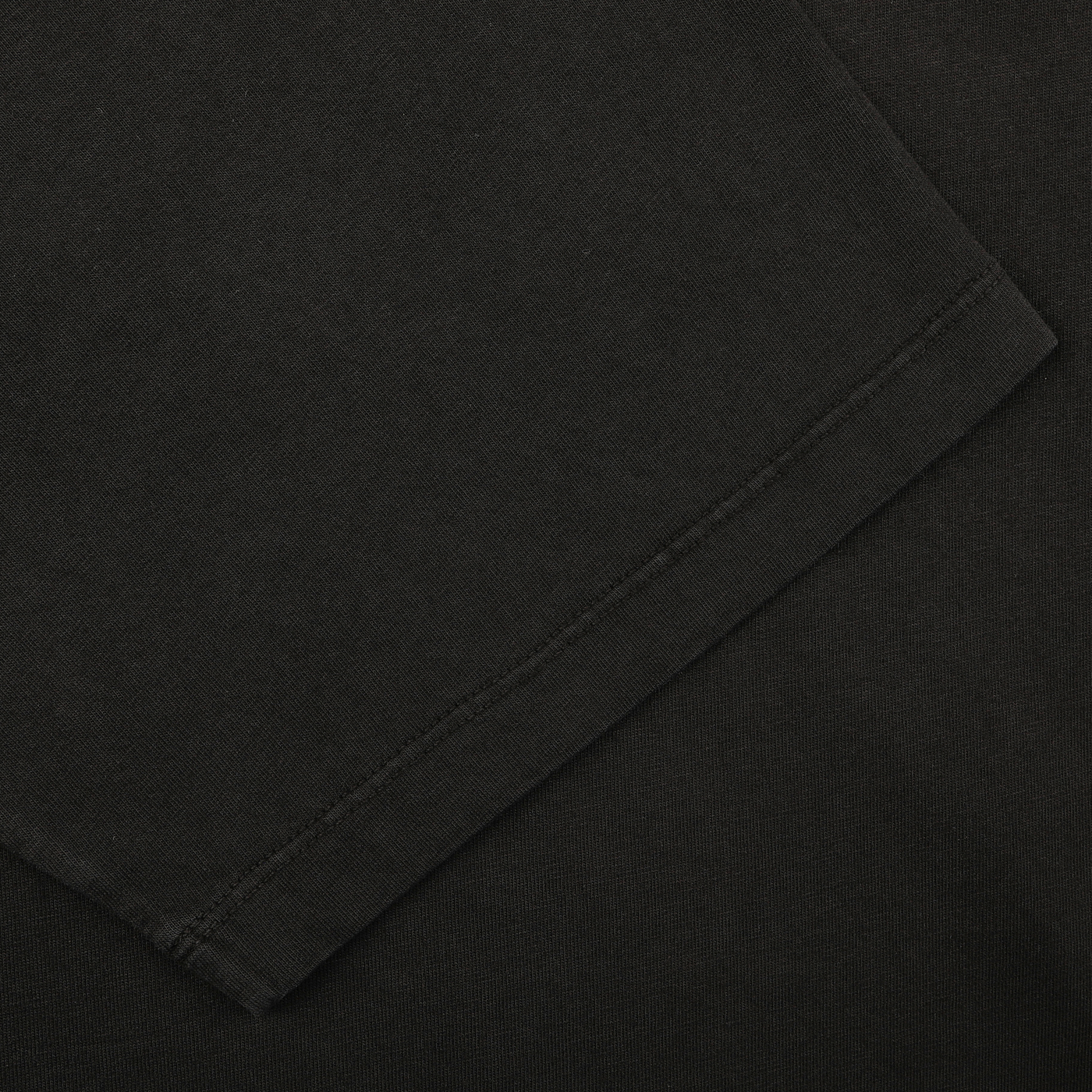 Close-up of a Black Organic Cotton Crewneck T-Shirt by C.O.F Studio, showcasing visible stitching.