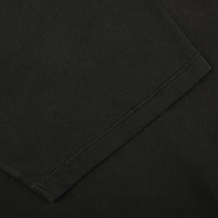 Close-up of a Black Organic Cotton Crewneck T-Shirt by C.O.F Studio, showcasing visible stitching.