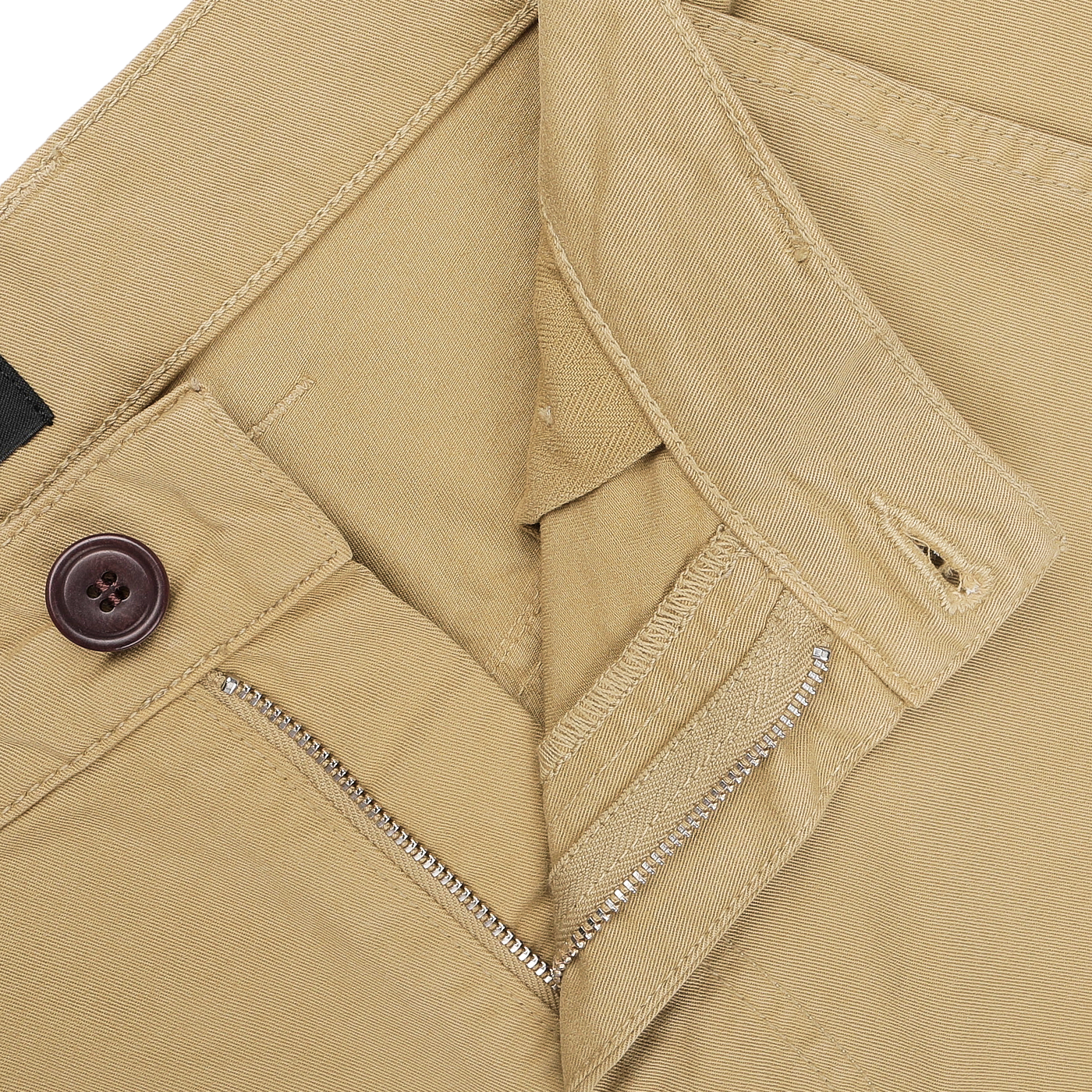 Close-up of a pair of khaki fatigue pants designed by C.O.F Studio, made from double twisted cotton twill, showcasing a zipper partially open and a dark button fastened.